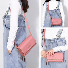 A pink rectangular shoulder bag with a zipper closure and a long strap worn by a woman.