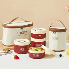 A set of round red stainless steel lunch boxes with matching insulated carrying bags.