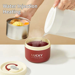 A person pours hot water into the base of a red and cream insulated stainless steel lunch box.