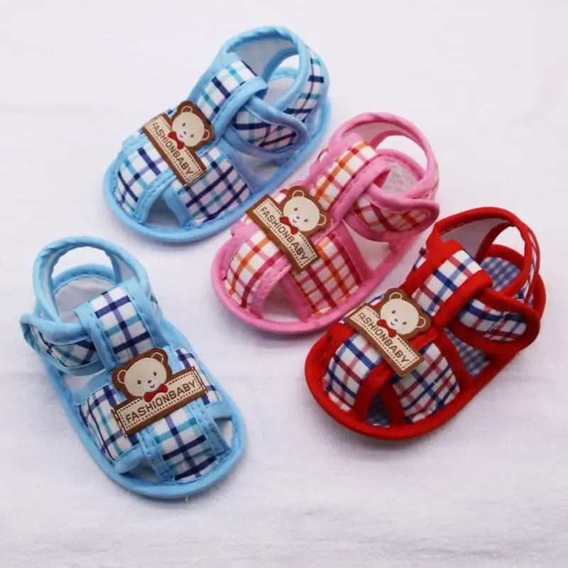 Baby boy and girl wearing Baywell Baby Bear Hollow Sandals, soft cotton first walker shoes with bear pattern for infants and toddlers.