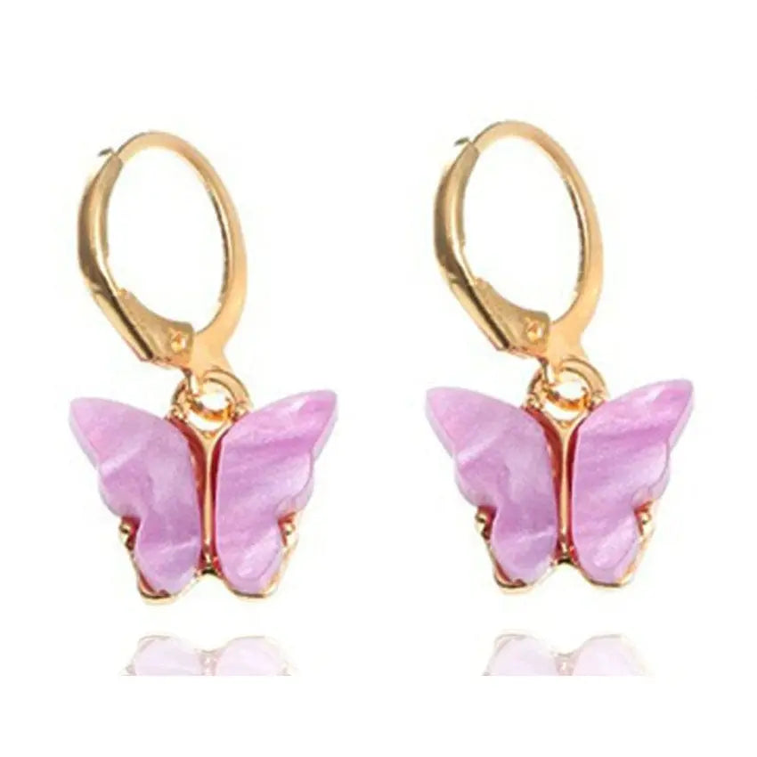 Pink butterfly pendant earrings by Showlu Fashion, alloy ear clips with a delicate butterfly design and natural style.