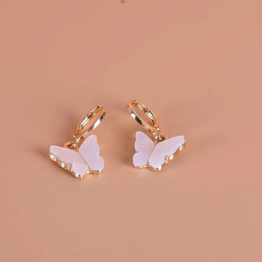 Pink butterfly pendant earrings by Showlu Fashion, alloy ear clips with a delicate, natural butterfly design for stylish wear.