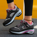 SHOWLU Women's Air Cushion Hiking Sneakers with lightweight design and lace-up closure, ideal for outdoor activities and comfort.