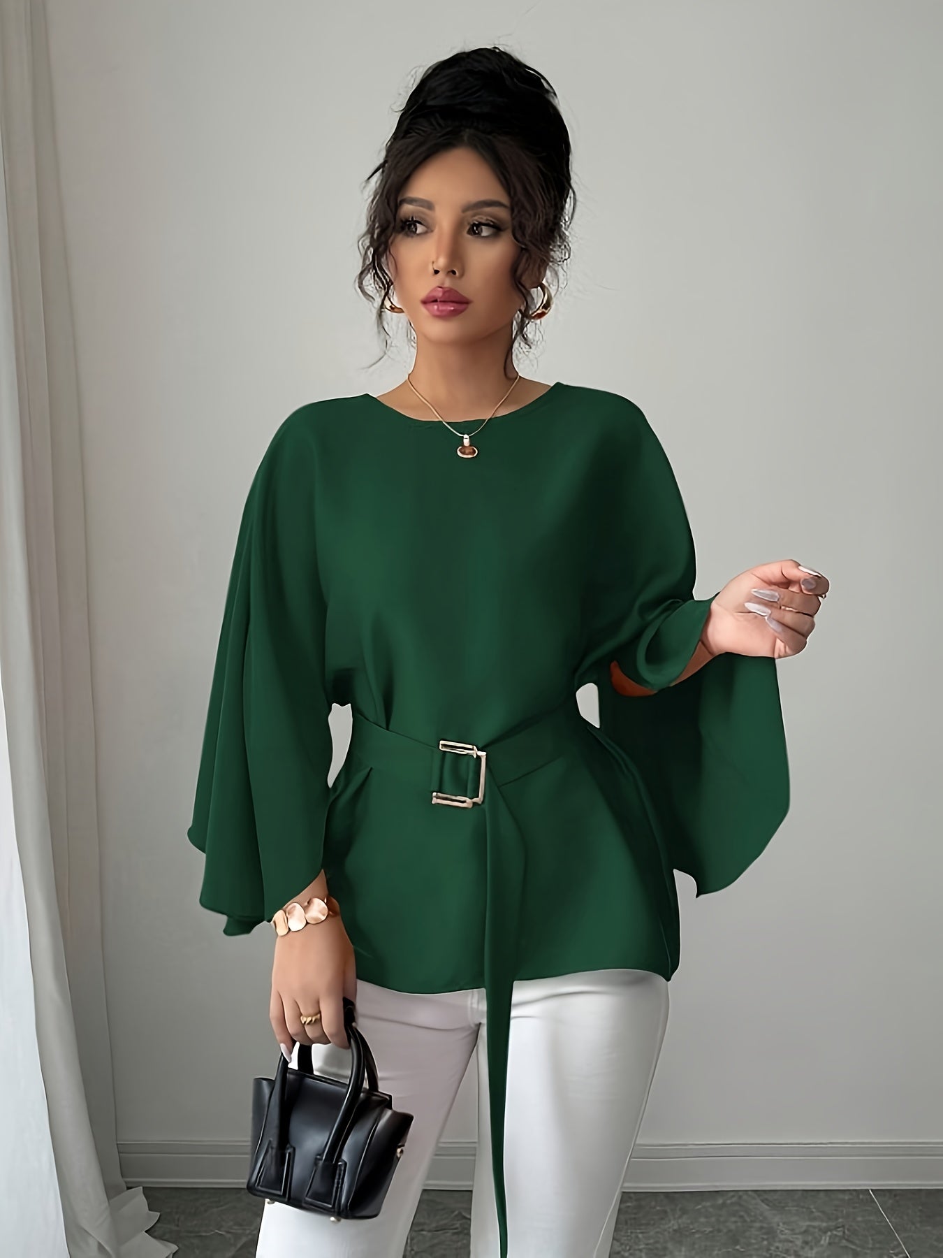 Light blue SHOWLU FASHION long sleeve belted blouse with elegant crew neck, featuring a fitted silhouette and stylish design.