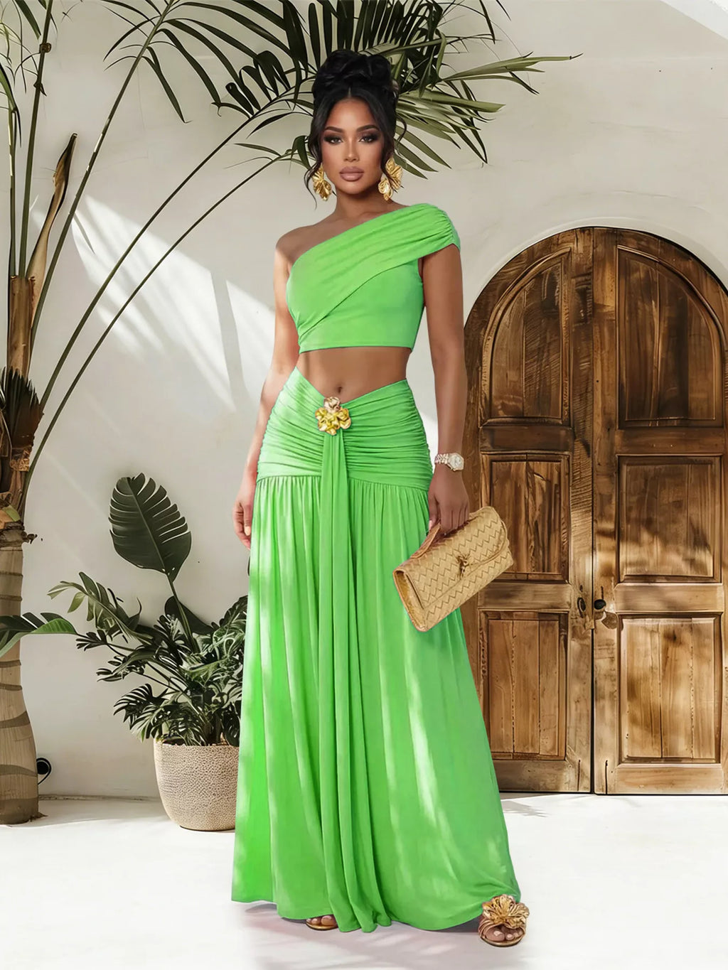 Trendsi one-shoulder top and ruched maxi skirt set featuring a stylish, coordinated look with a fitted top and flowing skirt.
