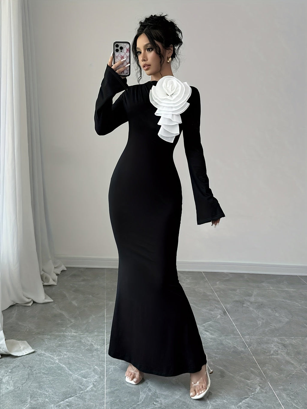 Women's black bodycon party dress with 3D floral appliqué by SHOWLU FASHION, featuring a fitted silhouette and elegant floral details.