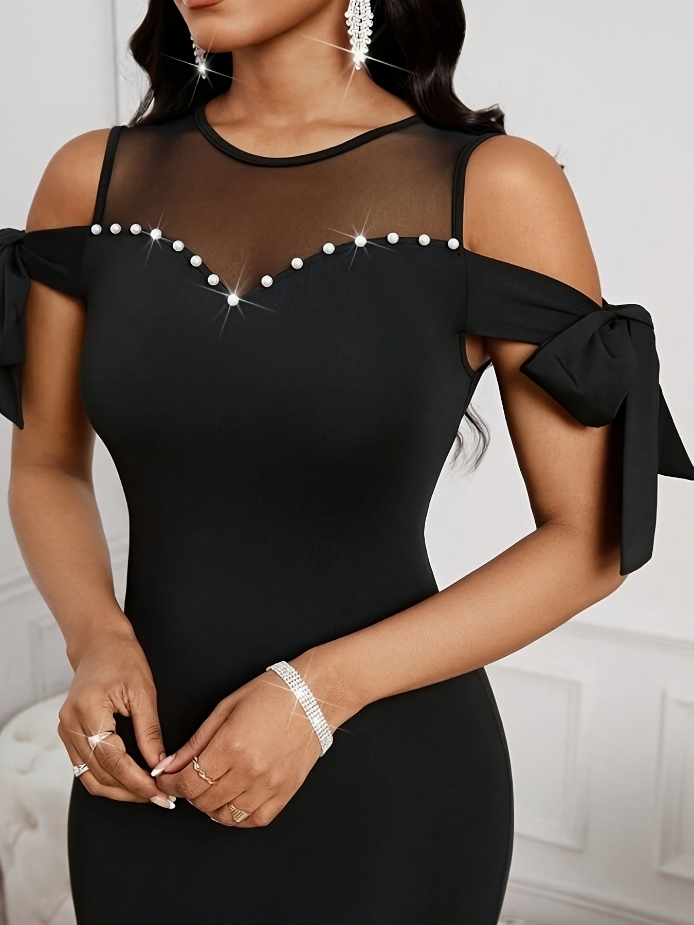 Black SHOWLU Women's Off-Shoulder Bodycon Dress with mesh details, perfect for evening wear and formal occasions.