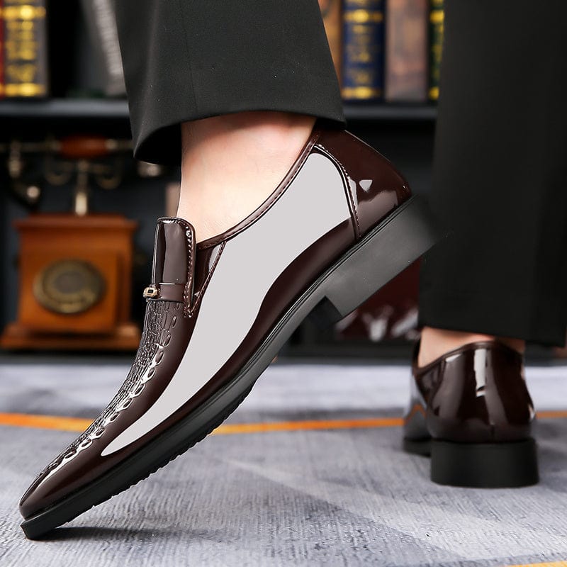 Pair of SHOWLU FASHION men's vintage loafers with pointed toes, faux leather upper, slip-on design, and rubber soles.