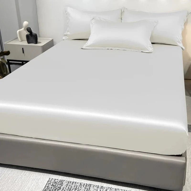 Showlu Fashion satin fitted sheet in solid ice silk color, modern and smooth bedding for a comfortable bedroom setup.