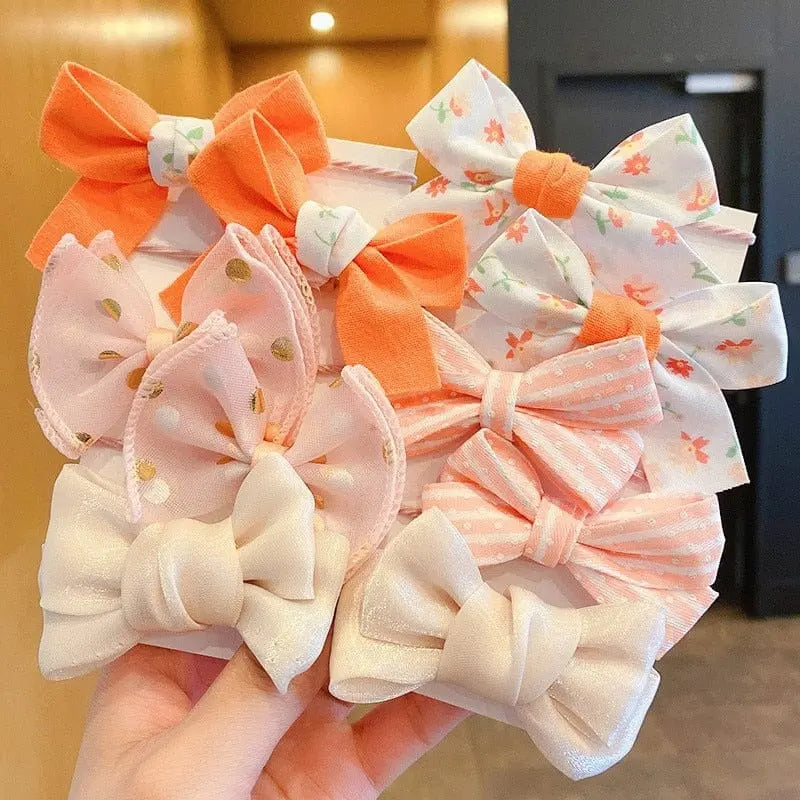 Set of 10 big bow flower elastic hairbands for girls and kids, colorful and cute hair accessories with rubber bands.