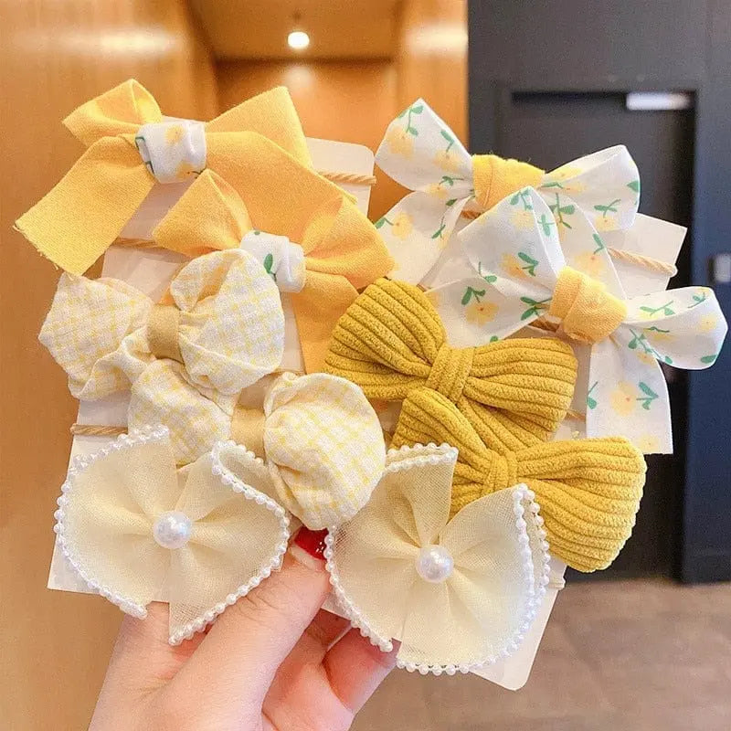 Set of 10 big bow flower elastic hairbands for girls and kids, featuring colorful, fashion-forward hair accessories and rubber bands.