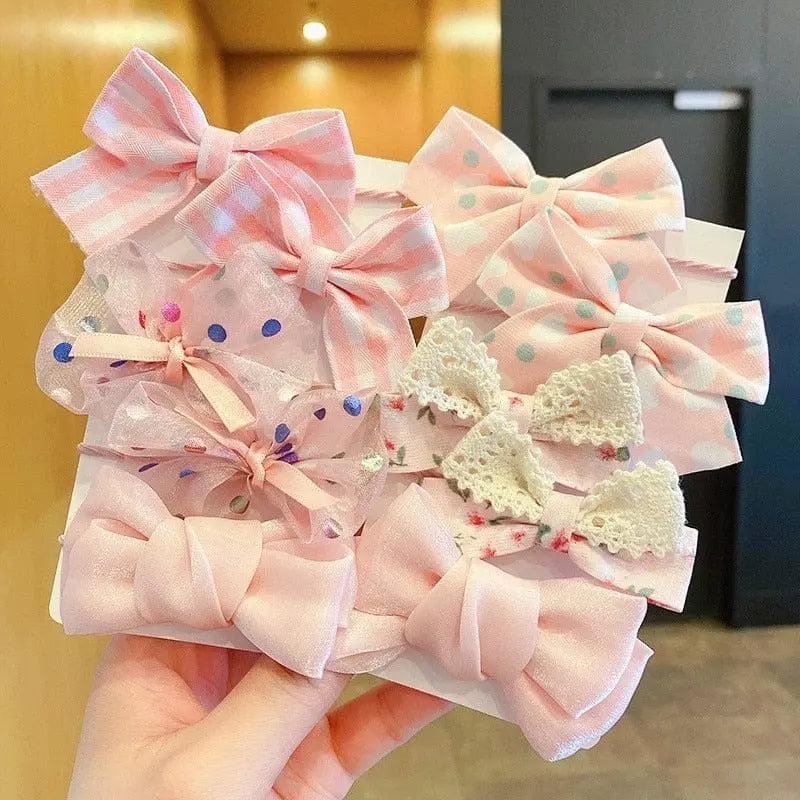 Set of 10 big bow flower elastic hairbands for girls and kids, showing colorful, playful hair ties with large bow and flower designs.