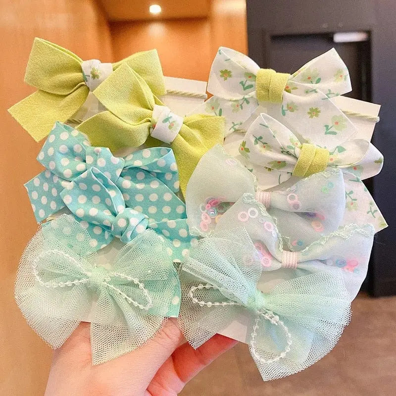 Set of 10 GEONYIEEK big bow flower elastic hairbands for girls and kids, colorful and stylish hair accessories for children.