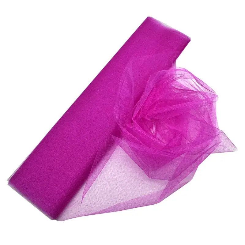 YONGSNOW 10m sheer crystal organza tulle roll for wedding arch decor, in 48cm width, shown draped on a wedding arch.