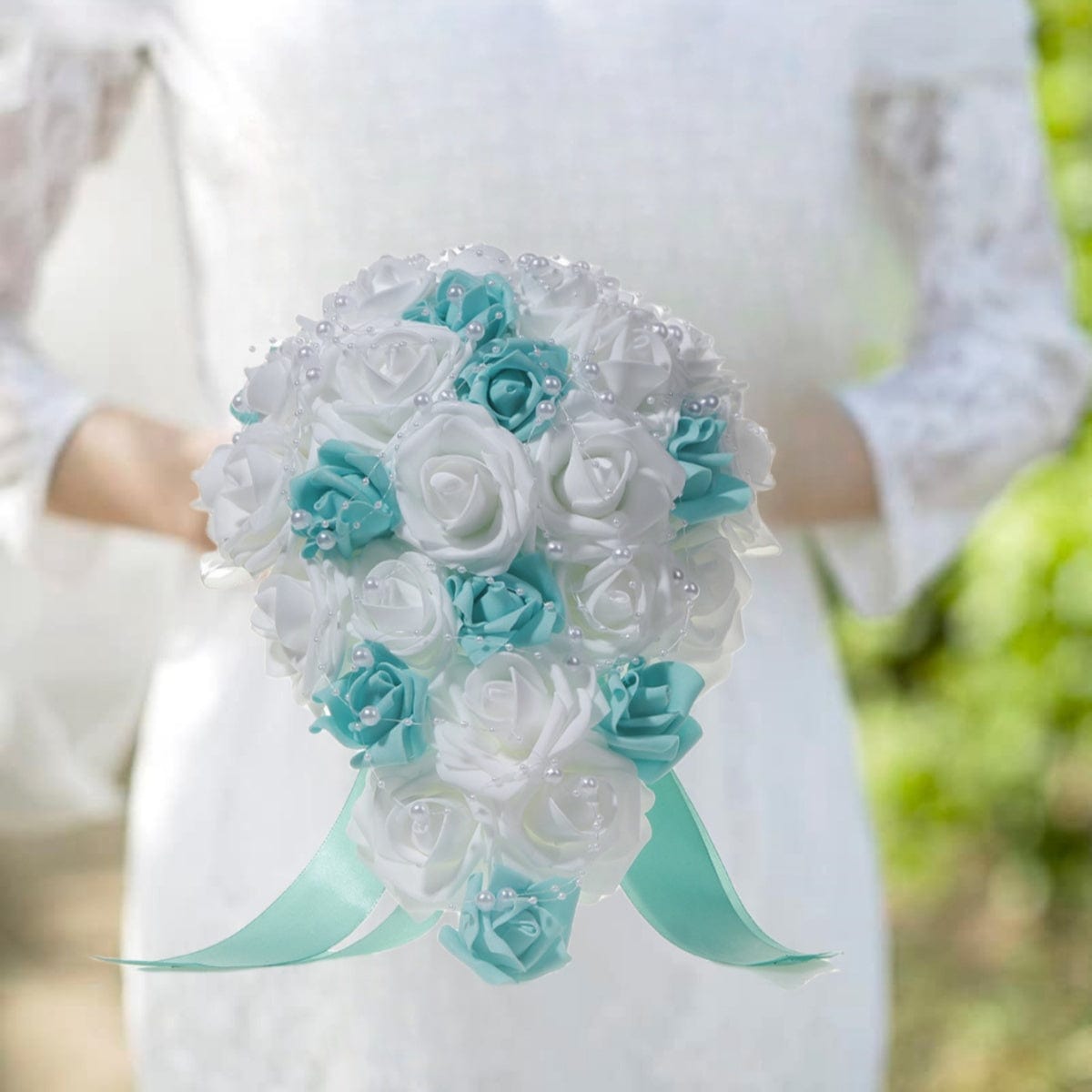 White and blue pearl ribbon silk bridal wedding bouquet with handmade artificial flowers, held in hand for wedding or special occasion.
