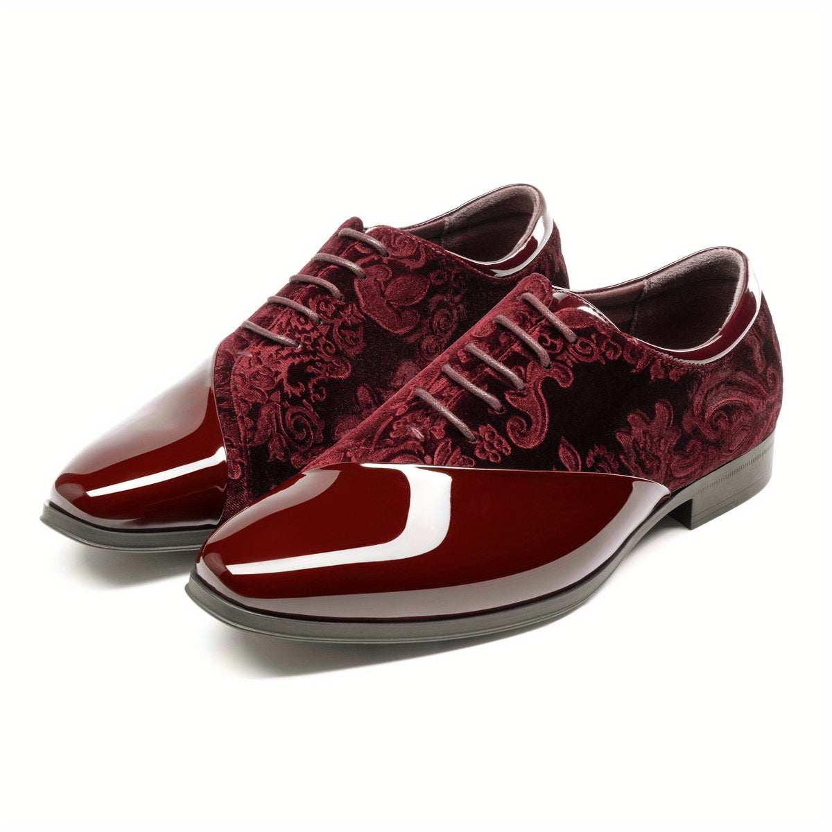 A pair of burgundy velvet and glossy patent leather men's oxford dress shoes with lace-up closures.