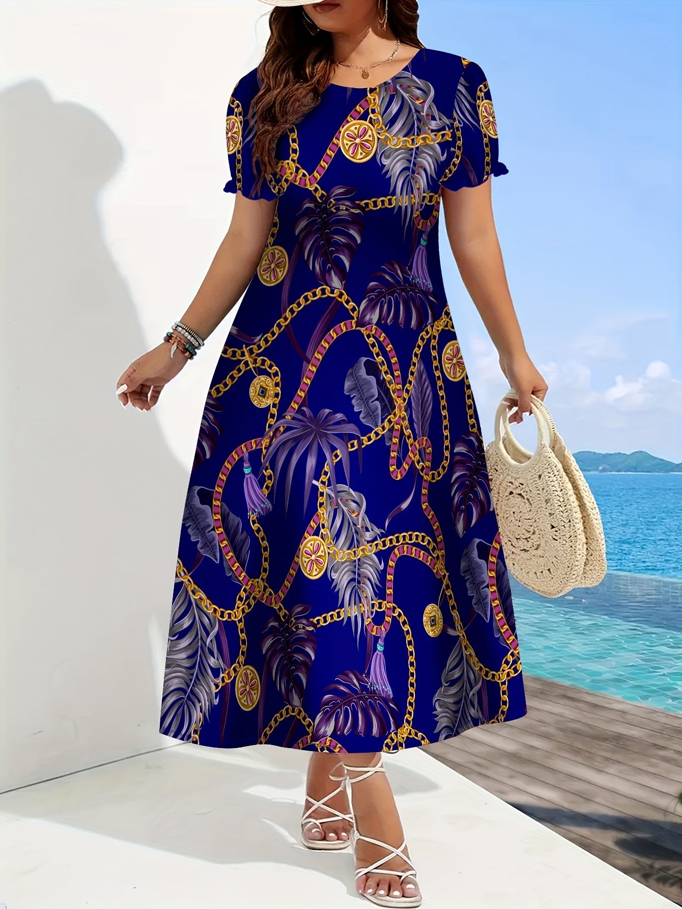 SHOWLU Women's tropical chain print A-line dress in blue and gold, featuring a vibrant pattern and flowing silhouette.