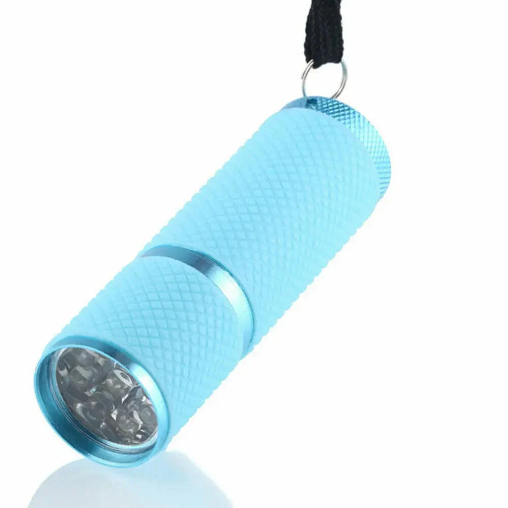 Showlu Mini UV LED Nail Lamp with 9 LEDs, portable gel polish flashlight, wireless design, compact nail curing device.