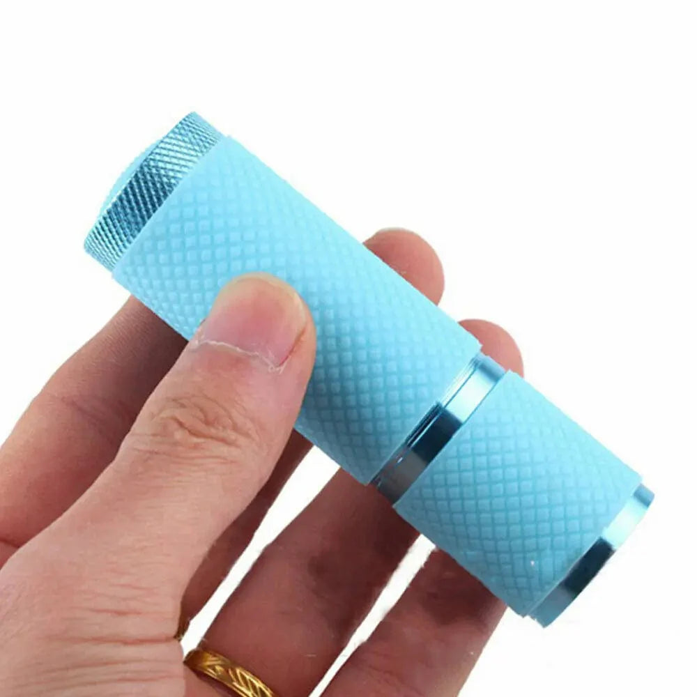 Showlu Mini UV LED Nail Lamp with 9 LEDs, portable gel polish flashlight, wireless compact nail curing torch.