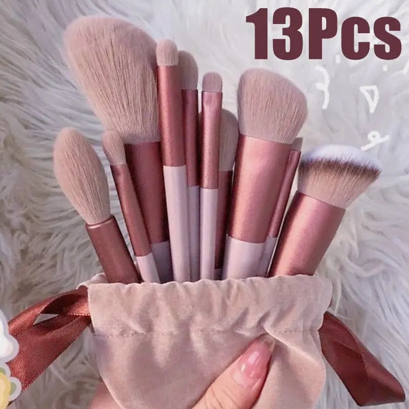 Showlu 13-piece makeup brush set with soft foundation and eye brushes in a black carrying bag, ideal for cosmetics application.
