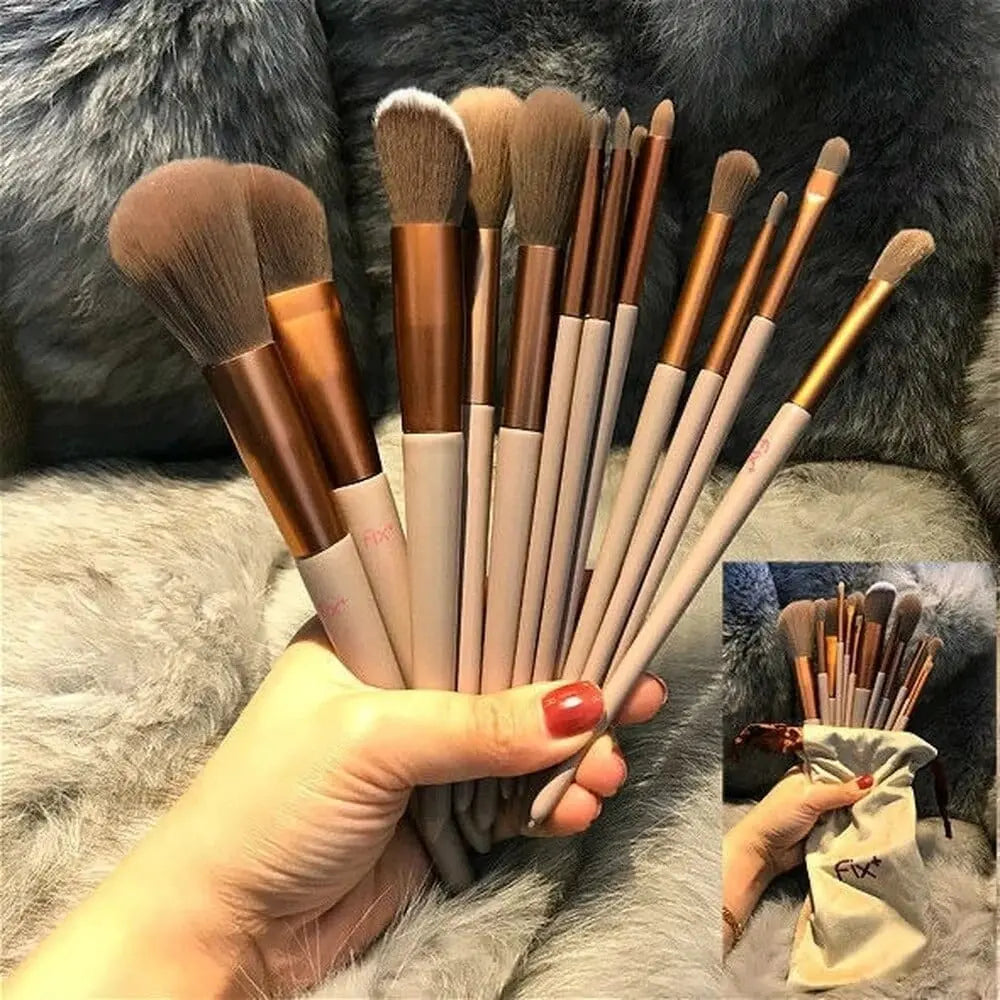 Showlu 13-piece makeup brush set with soft foundation, eye shadow, blush brushes, and a convenient carrying bag.