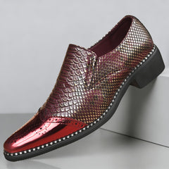 A slip-on formal shoe featuring a metallic red brogue toe and a gold snake-scale patterned upper.