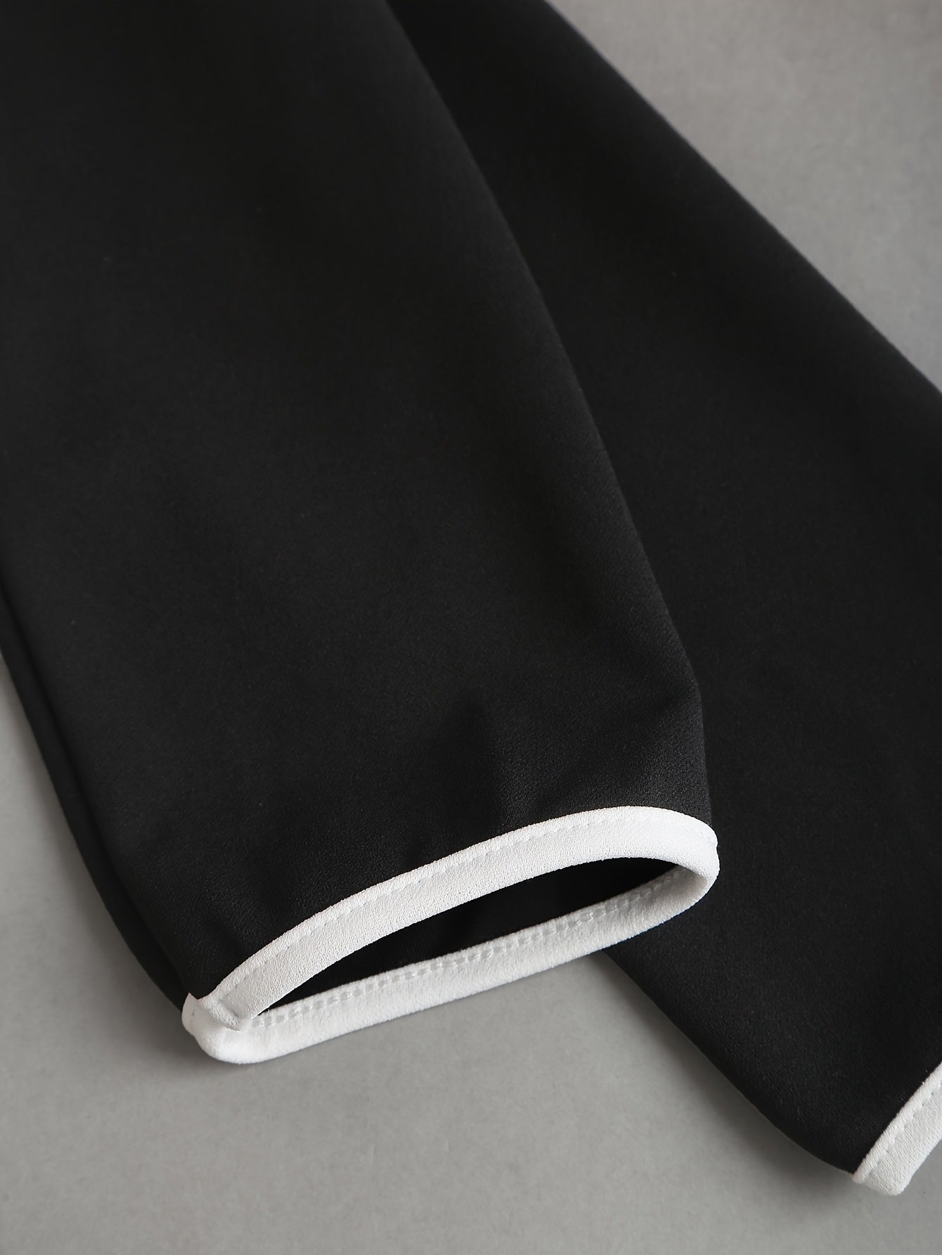 V-neck two-tone slim fit dress by SHOWLU FASHION STORE with belt and pockets, shown on a model.