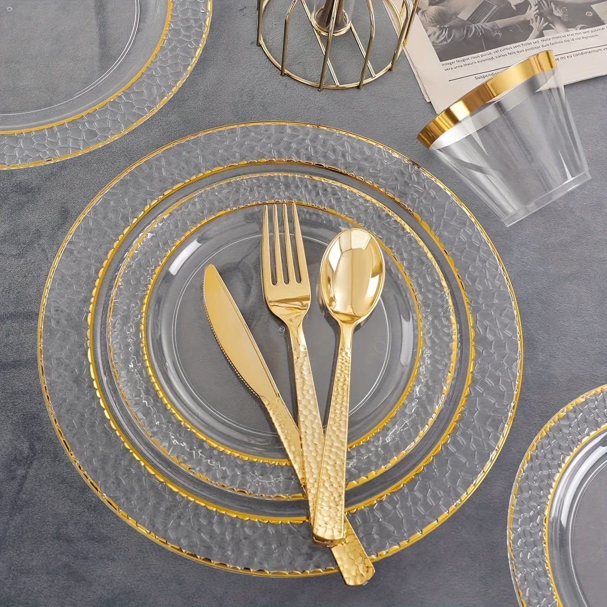 Showlu 150-piece gold rim plastic plates and cutlery set for wedding parties, includes dinner plates, dessert plates, forks, knives, spoons, and cups.