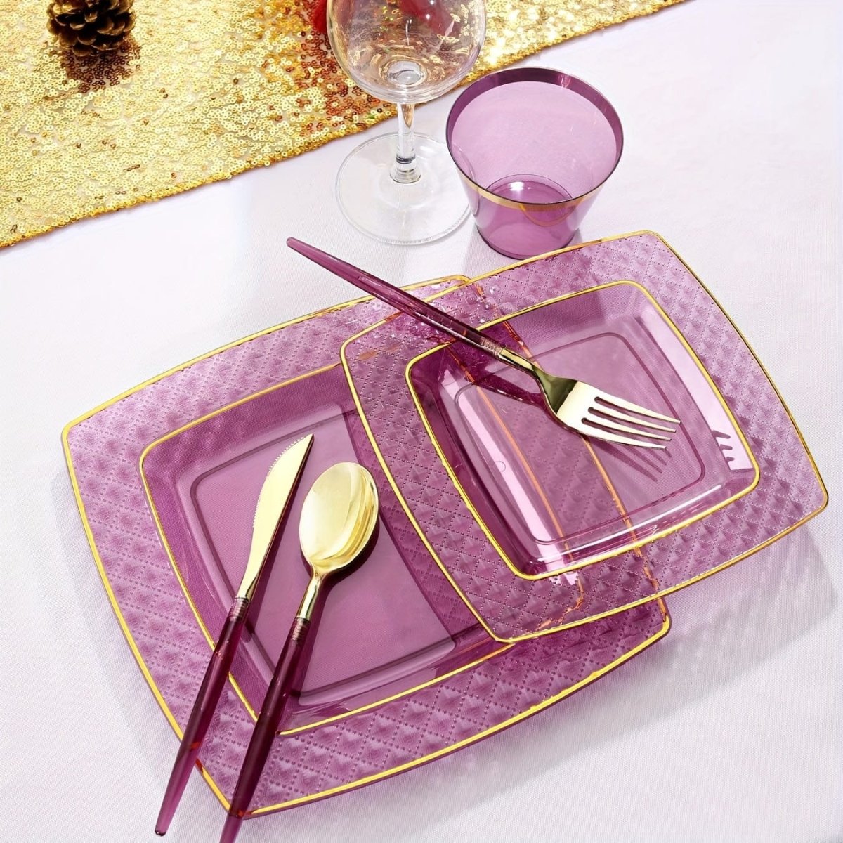 Showlu Purple Square Plastic Plates and Gold Cutlery Set with 150 pieces including dinner plates, dessert plates, cups, forks, knives, and spoons.