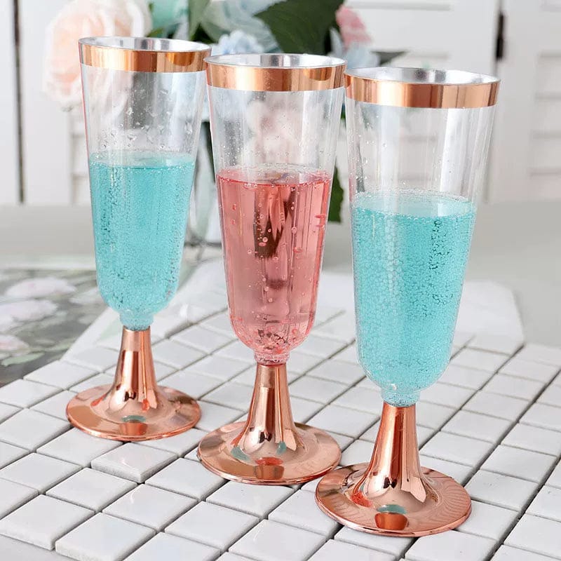 Showlu 175-piece rose gold disposable plastic tableware set with plates, cups, wine glasses, knives, forks, and spoons for events.
