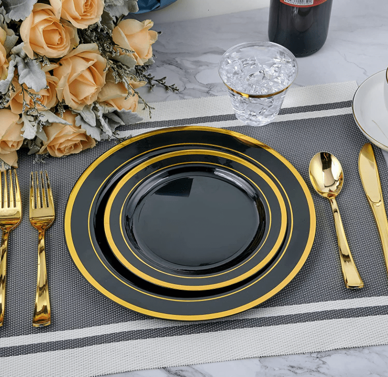 Showlu 175-piece rose gold disposable plastic tableware set with plates, cups, wine glasses, knives, forks, and spoons.