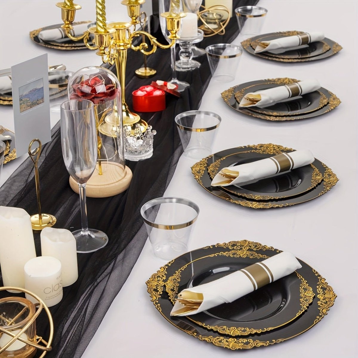 Showlu Fashion Store Nervure 175-piece disposable plastic party plates and cutlery set with black, gold, and blue accents for 25 guests.
