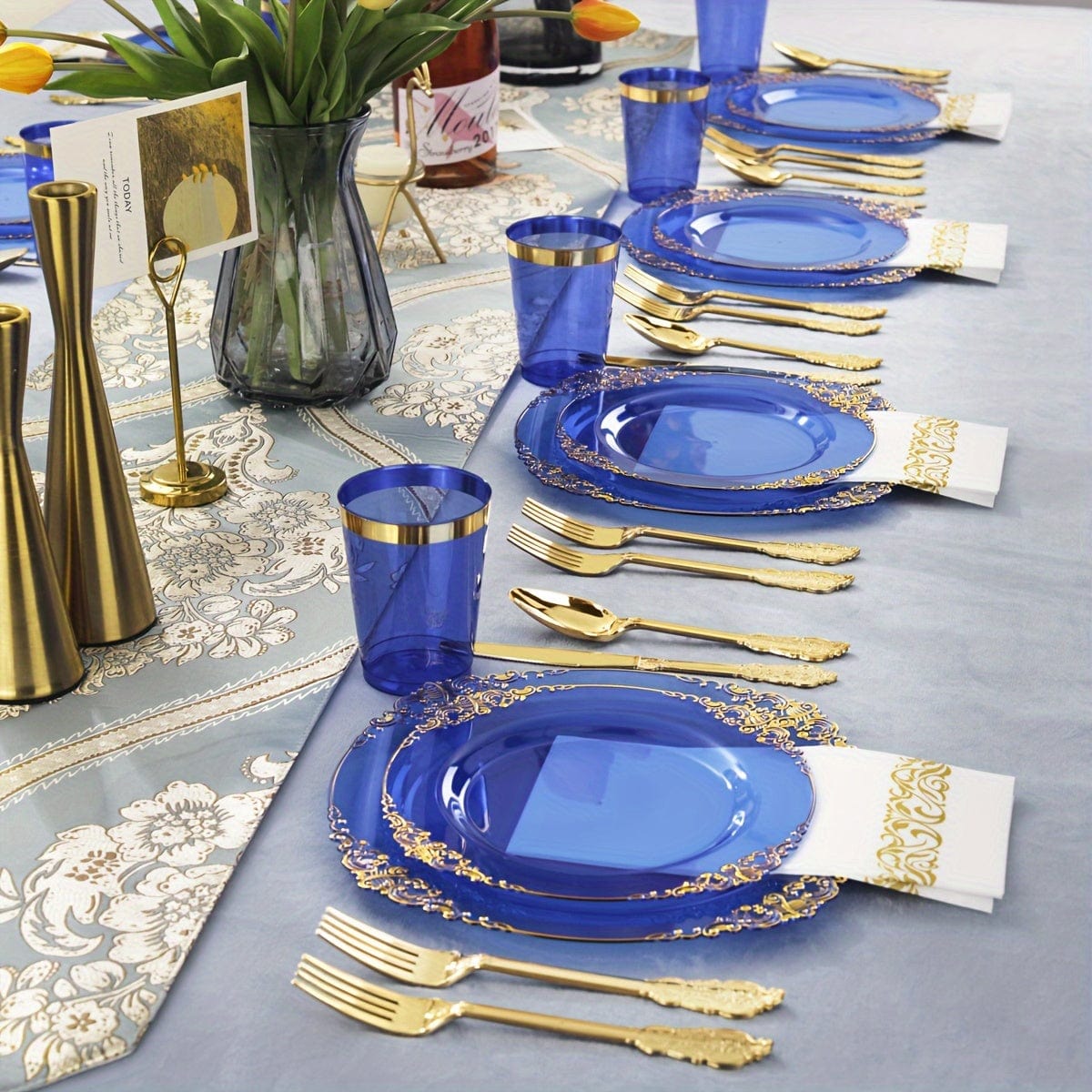 Nervure 175-piece gold plastic dinnerware set for 25 guests including purple and clear plates, cups, utensils, and napkins for parties