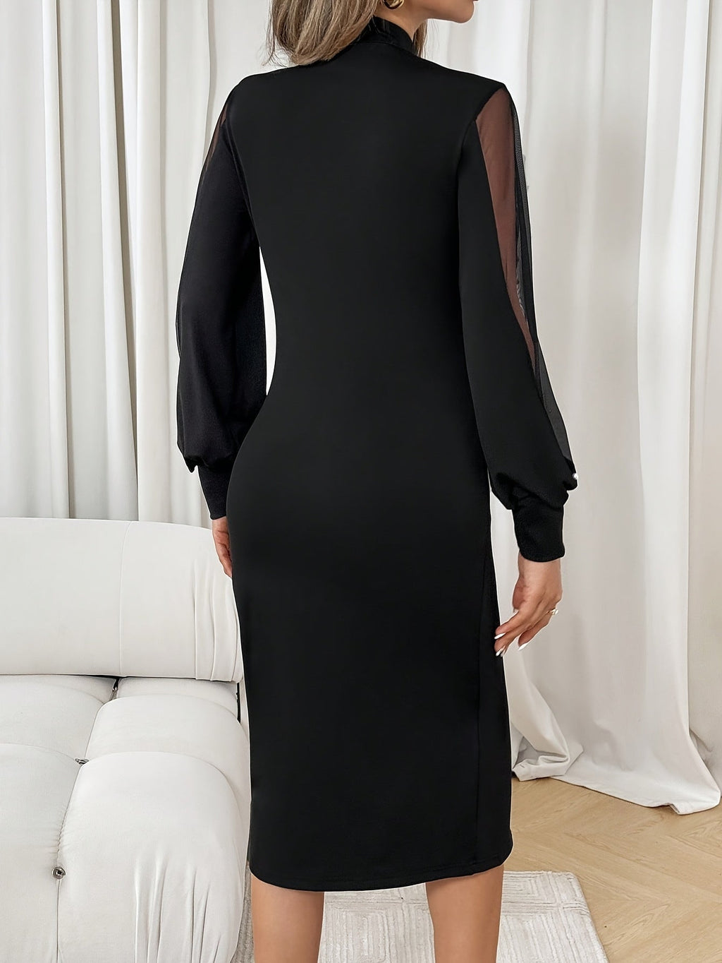 Black maxi dress for women by Showlu Fashion, featuring a fitted design and elegant crew neck neckline.