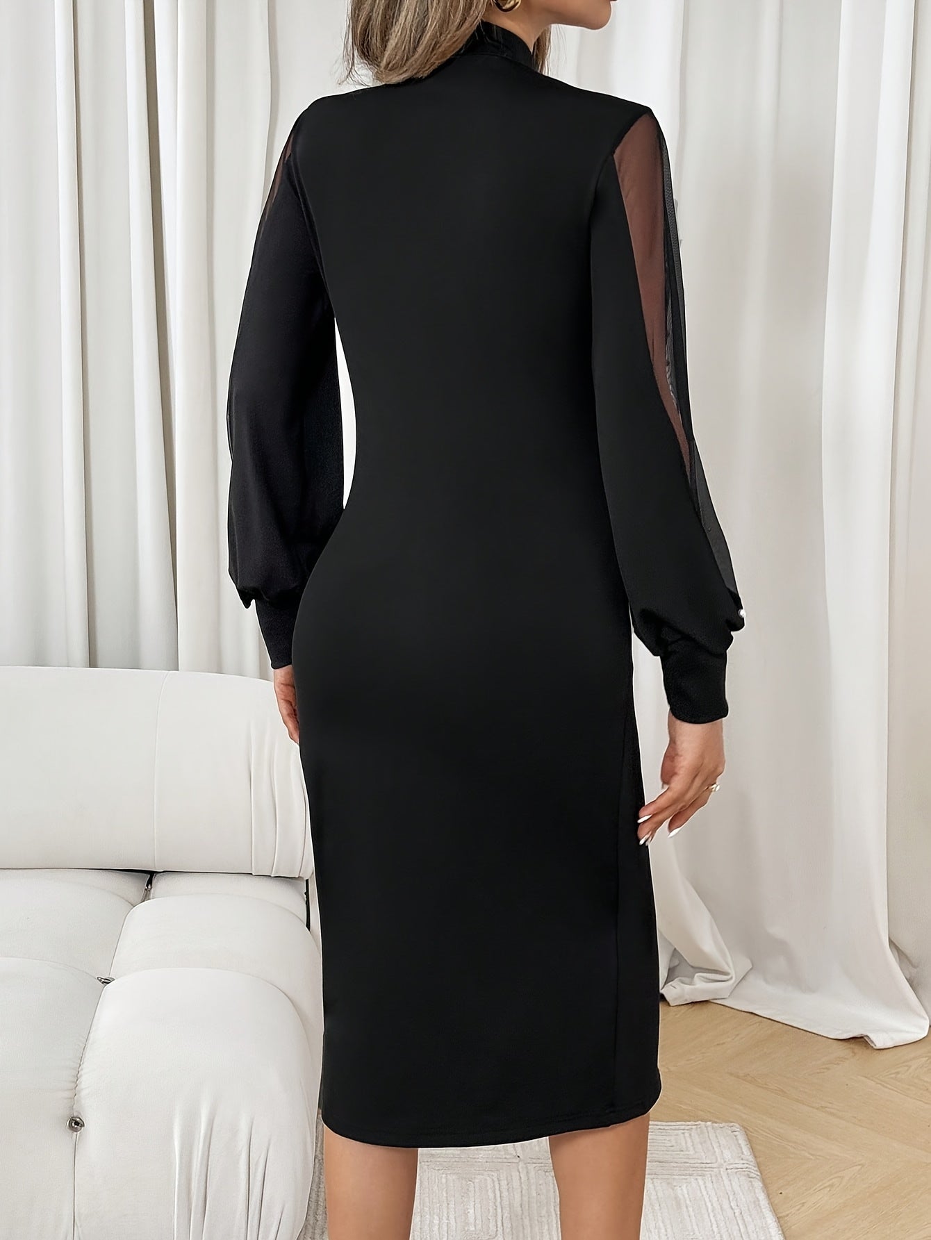 Black maxi dress for women by Showlu Fashion, featuring a fitted design and elegant crew neck neckline.