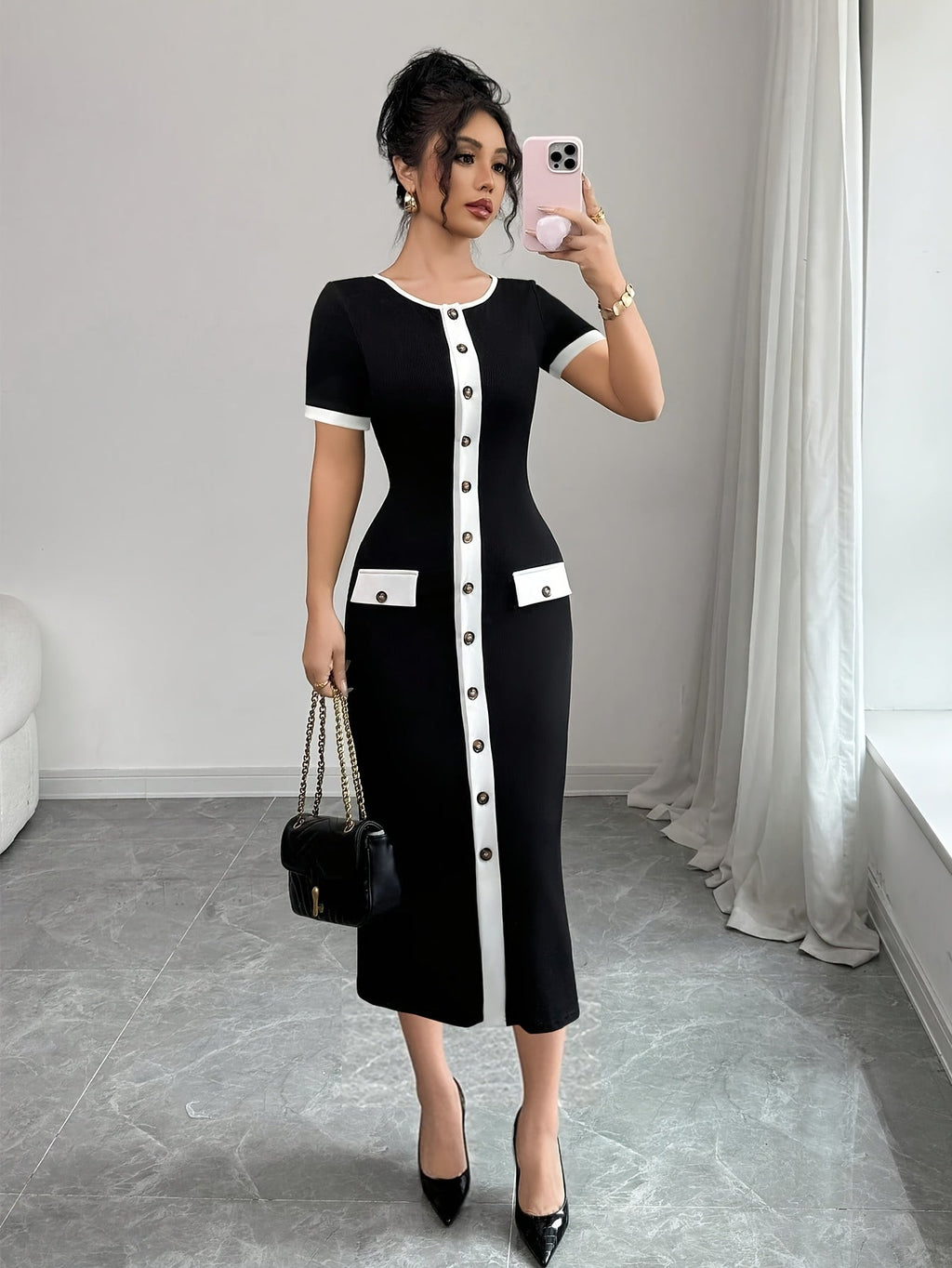 SHOWLU FASHION color block black and white A-line midi dress with crew neckline, stylish and elegant for casual or formal wear.