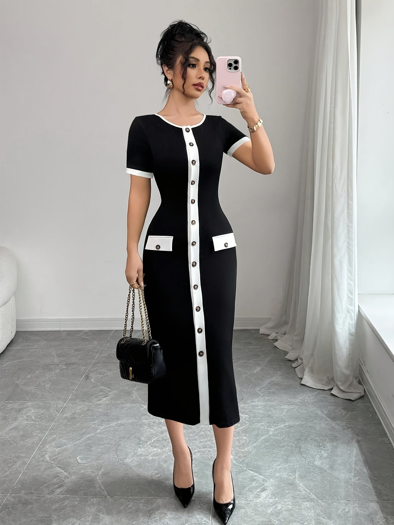 SHOWLU FASHION color block black and white A-line midi dress with crew neckline, stylish and elegant for casual or formal wear.