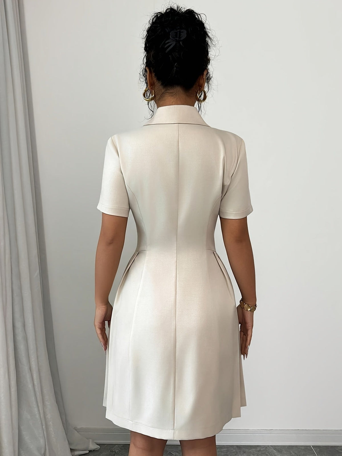 Light beige SHOWLU Women's V-Neck A-Line Dress with asymmetrical hem, flowing fabric and elegant style.
