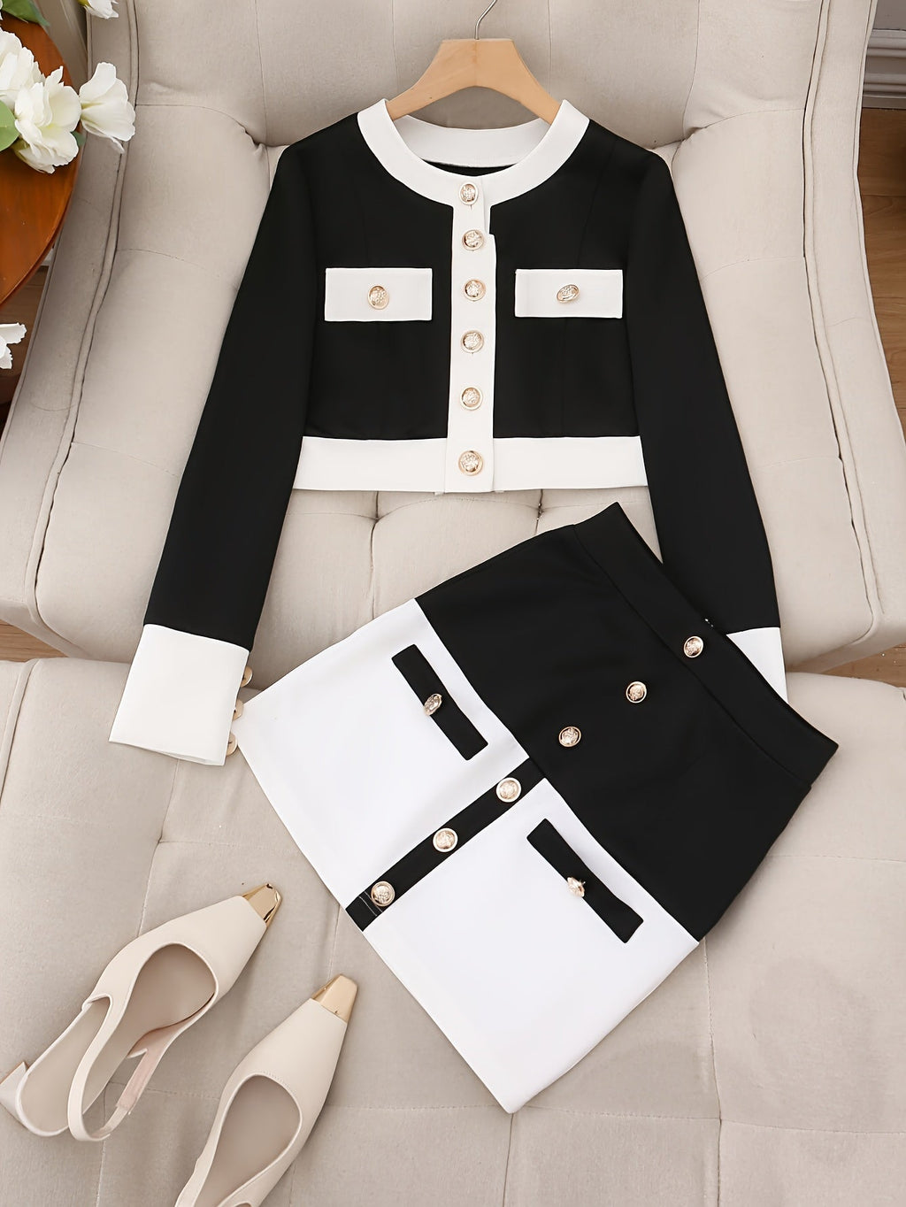 SHOWLU FASHION color block polyester jacket and skirt two-piece set displayed on a hanger with vibrant contrasting panels.
