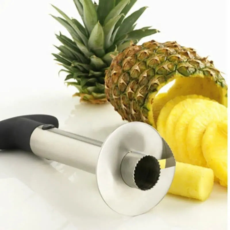 Showlu stainless steel pineapple slicer and peeler kitchen tool with ergonomic handle, designed for easy fruit preparation.