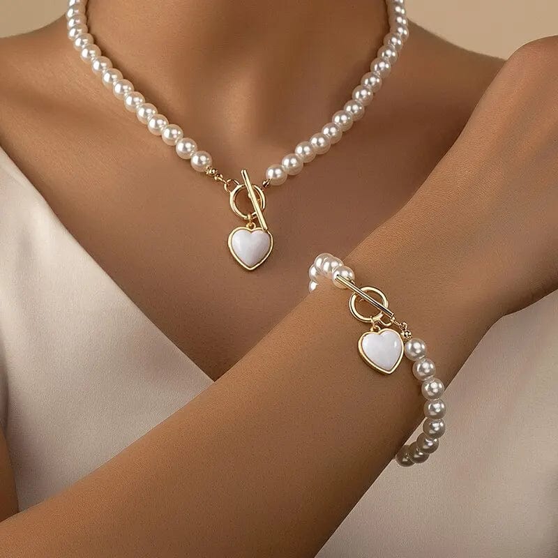Elegant Showlu fashion jewelry set with imitation pearl necklace and bracelet featuring natural-colored beads and pendants for women.