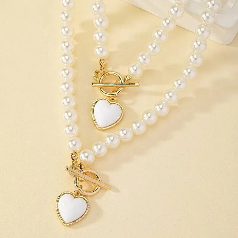Showlu 2-piece imitation pearl necklace and bracelet jewelry set with elegant pearl-colored beads and pendants for women.
