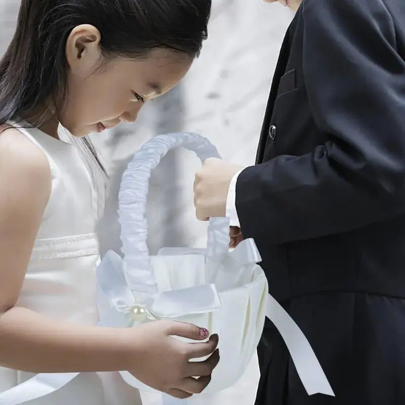 White silk flower girl basket from YONGSNOW, 20cm, perfect for wedding ceremony decor, held by flower girl during the wedding.