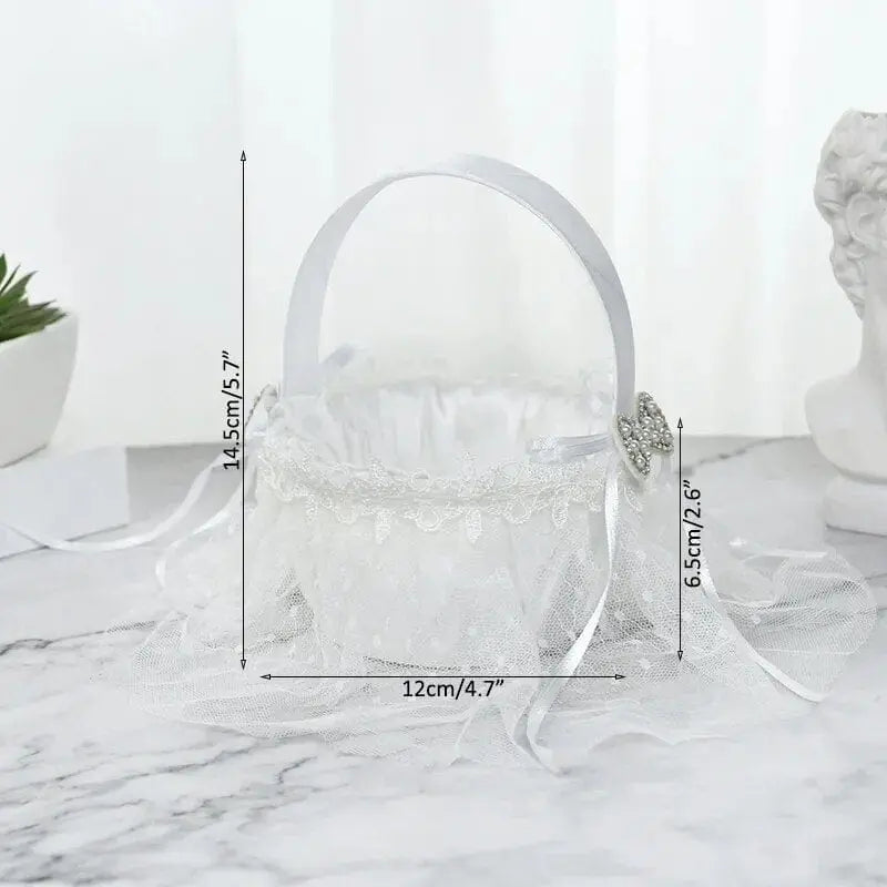 White silk flower girl basket from YONGSNOW, 20cm, elegant wedding ceremony decor, held by a young girl at a wedding.