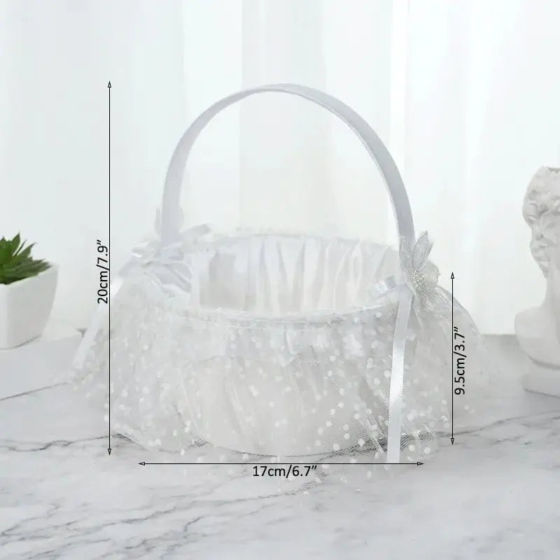White silk flower girl basket from YONGSNOW, 20cm, perfect for wedding ceremony decor, held by a flower girl during the celebration.