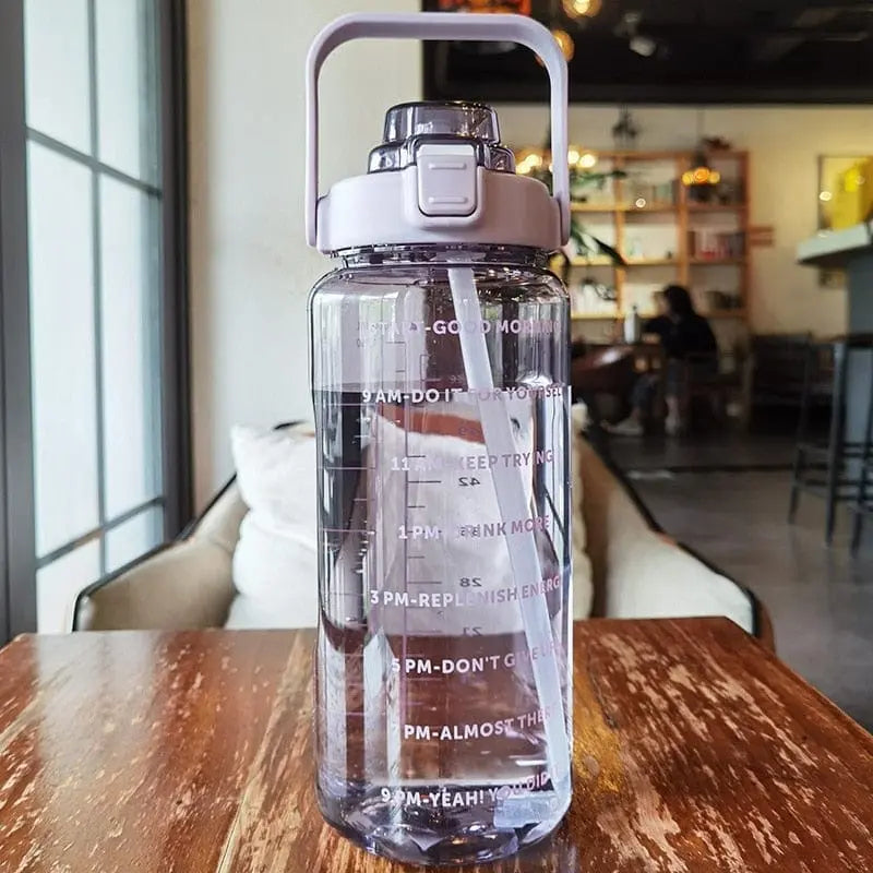Large 2000ml Showlu plastic sports water bottle with straw for outdoor camping and fitness hydration.