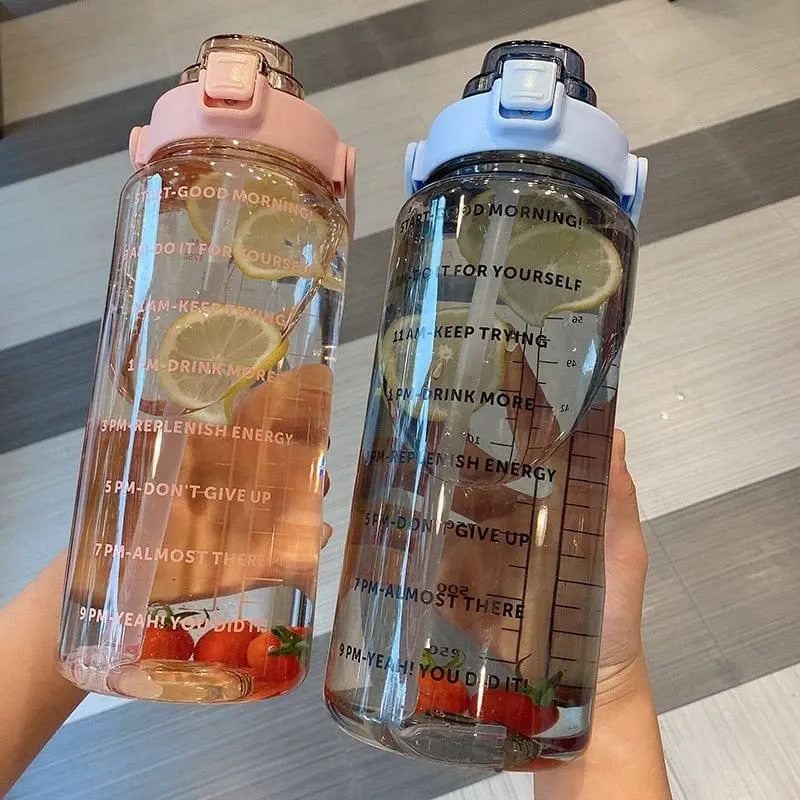 Showlu 2000ml large capacity plastic sports water bottle with straw for outdoor camping and hydration.