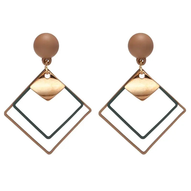 Showlu Korean geometric triangle tassel dangle earrings for women, featuring stylish gold-tone drop design with tassel accents.