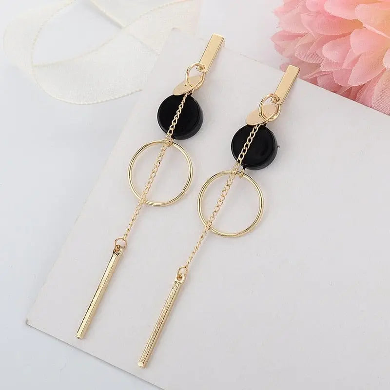 Showlu Korean geometric triangle tassel dangle earrings for women with long statement design and modern jewelry style.