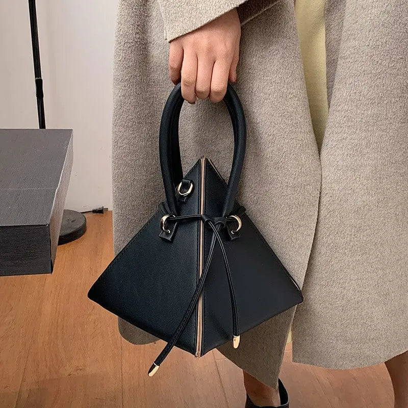 Chonghui women's triangle chain bucket bag in PU leather, crossbody style with metal chain strap, fashionable designer handbag.